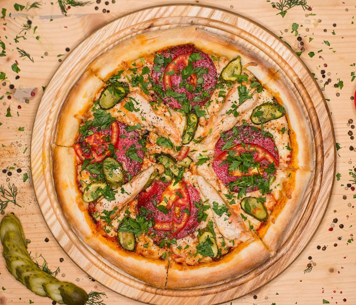 A pizza is sitting on a wooden cutting board on a wooden table.