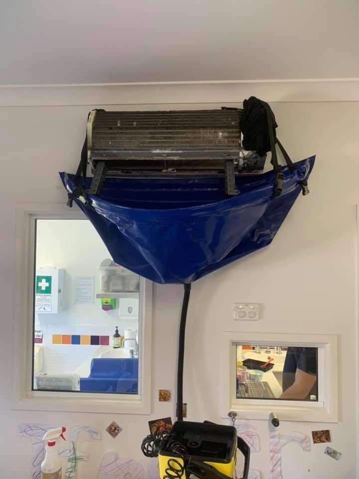 A Blue Bag is Hanging From the Ceiling of a Room — Northside Air Conditioning Services In Aspley, QLD