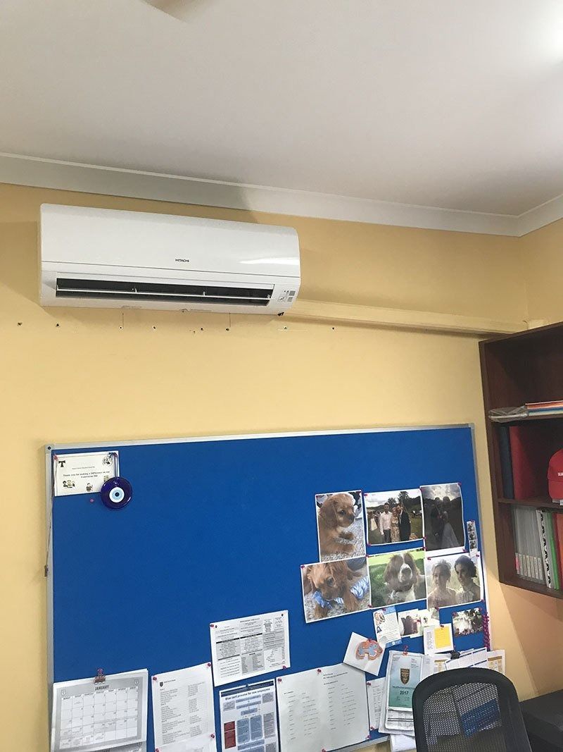 A Room With a Blue Board and a White Air Conditioner — Northside Air Conditioning Services In Aspley, QLD