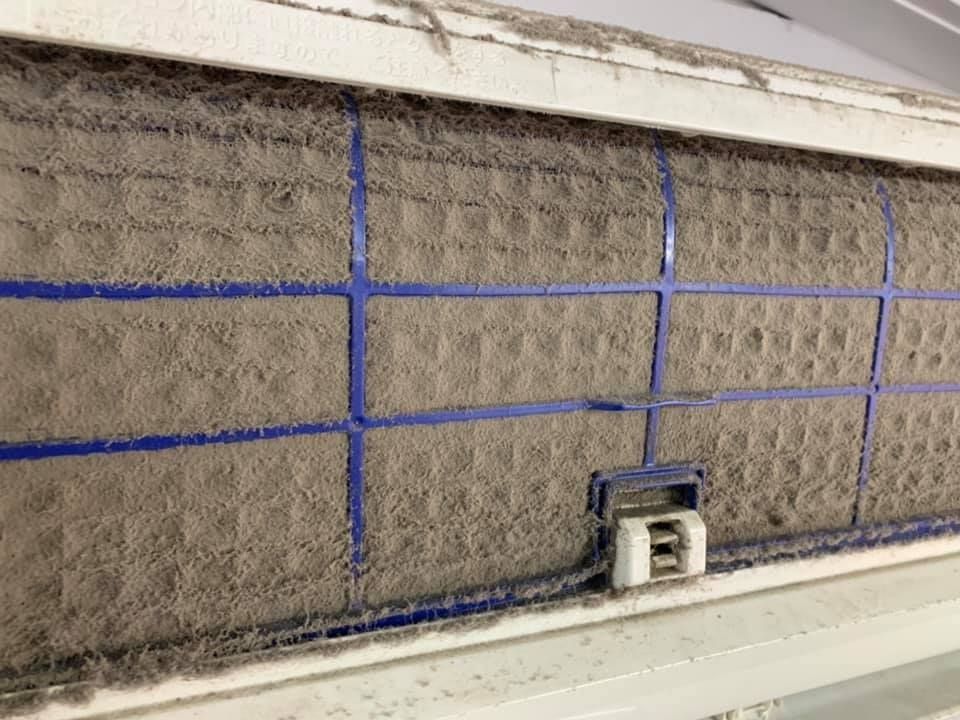 A Close Up of a Dirty Air Filter on a Wall — Northside Air Conditioning Services In McDowall, QLD