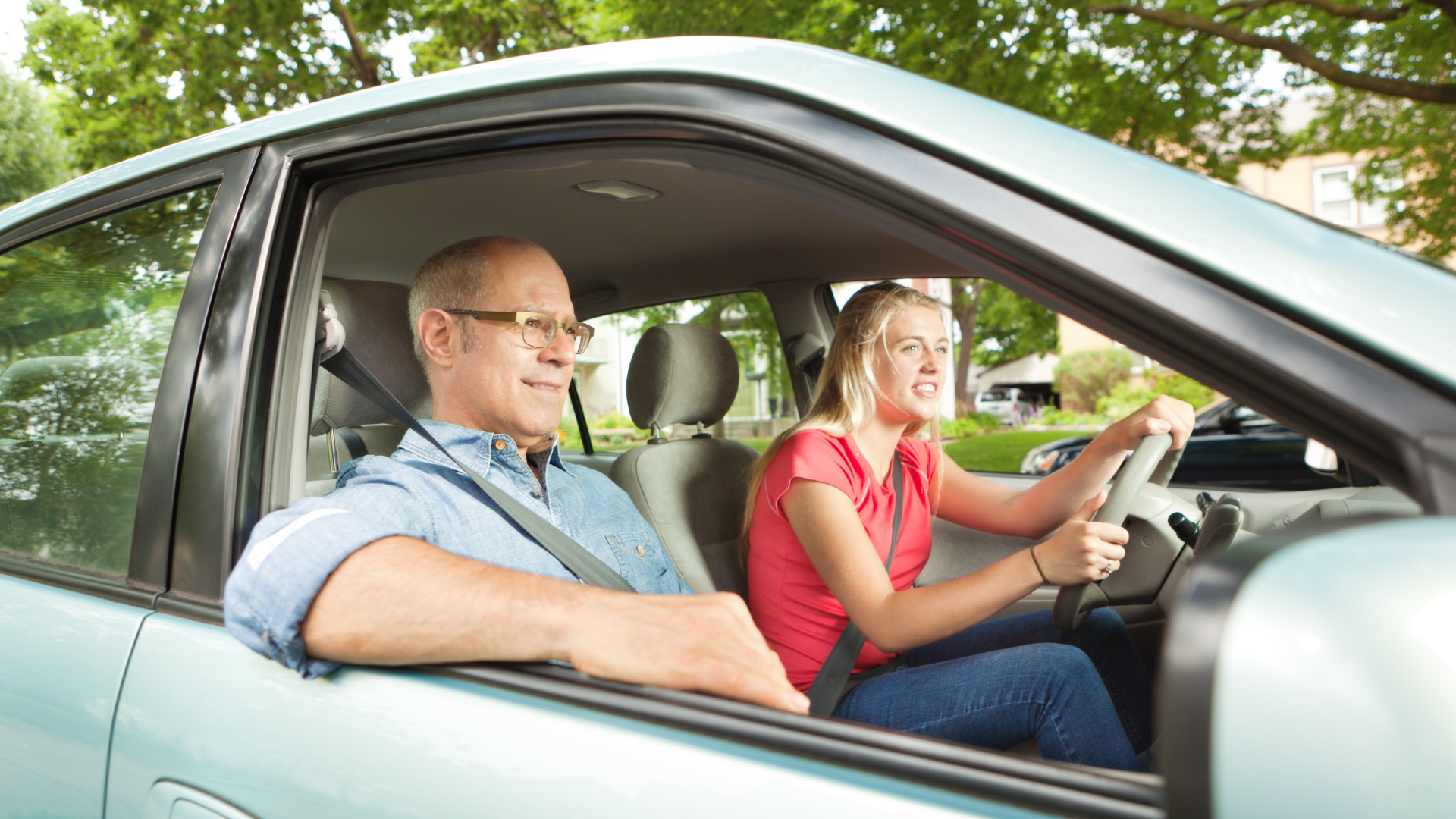 A man and a woman are standing next to each other and smiling.