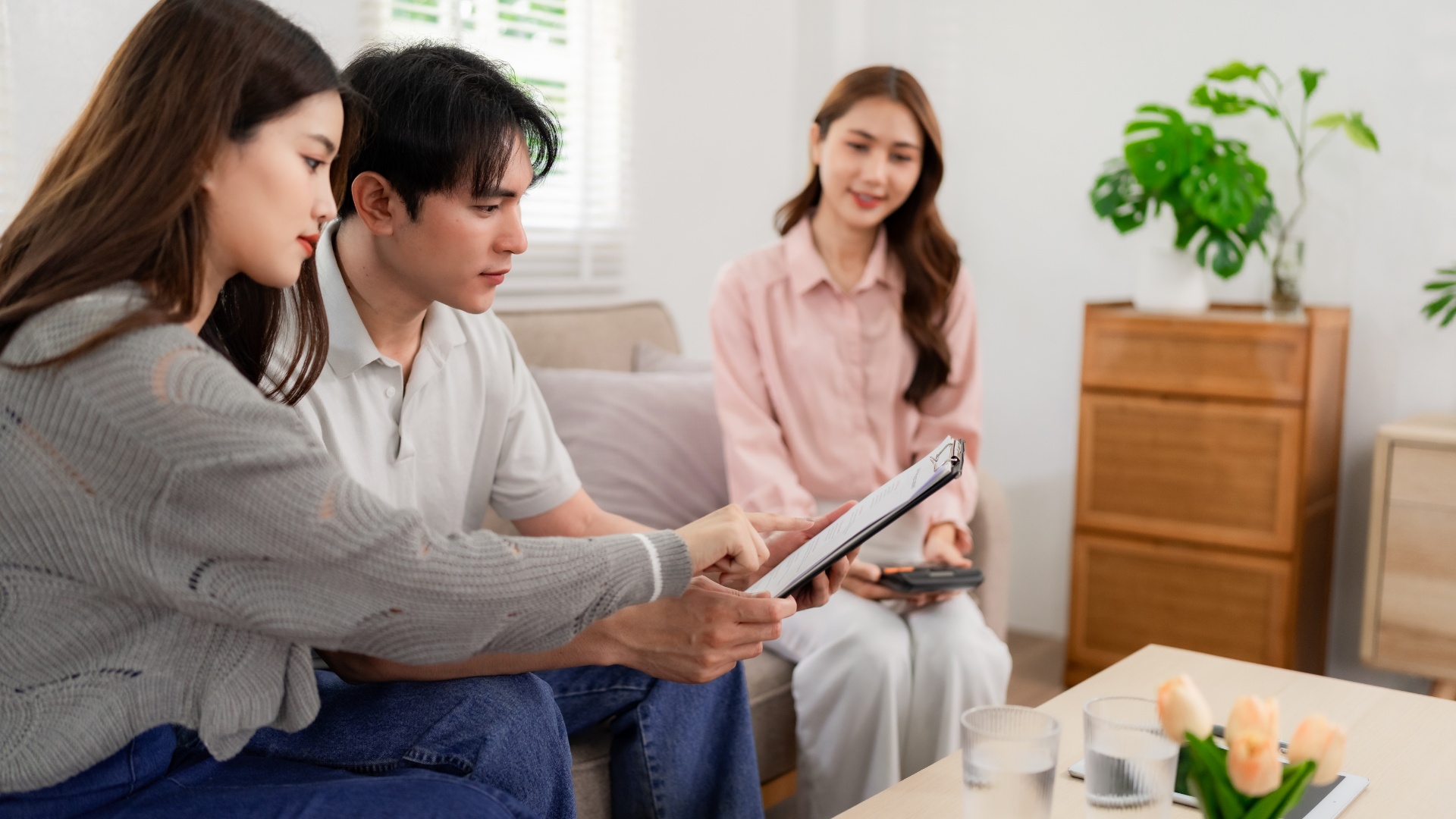 A man and a woman are standing next to each other and smiling.