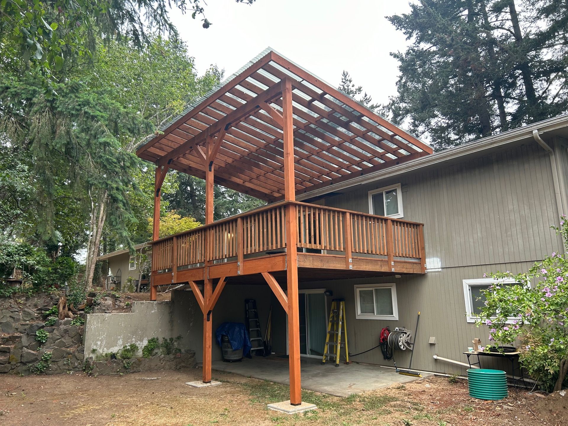 A group of people are having a barbecue in their backyard.