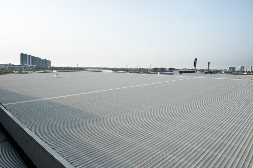 Man Repairing Metal Roof — Experienced Roofer in Brisbane, QLD