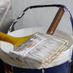 Selective,Focus,,White,Paint,Bottle,And,Paint,Brush.,Paint,Material