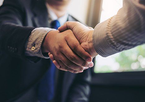 Assurance Services  — Two business men shaking hands in Indianapolis, IN
