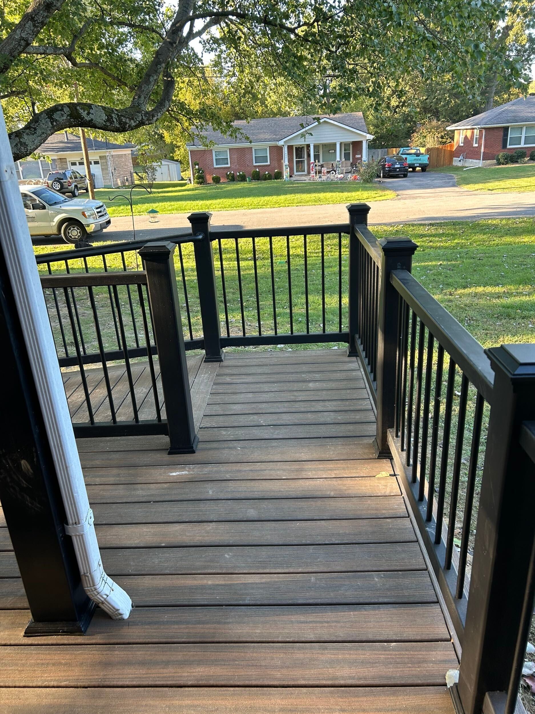 Low-maintenance composite deck with hidden fasteners and PVC fascia trim