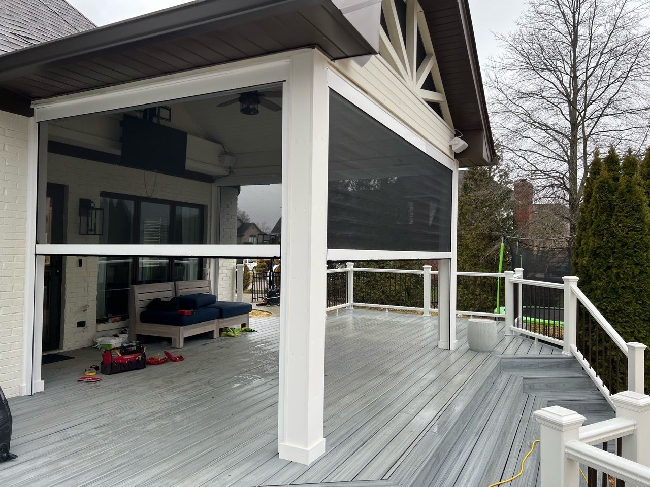 Custom-built Trex composite deck with black aluminum railing in Louisville backyard