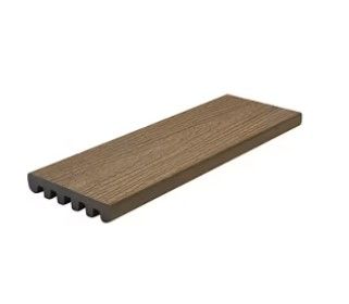 A piece of wood is sitting on top of a white surface.