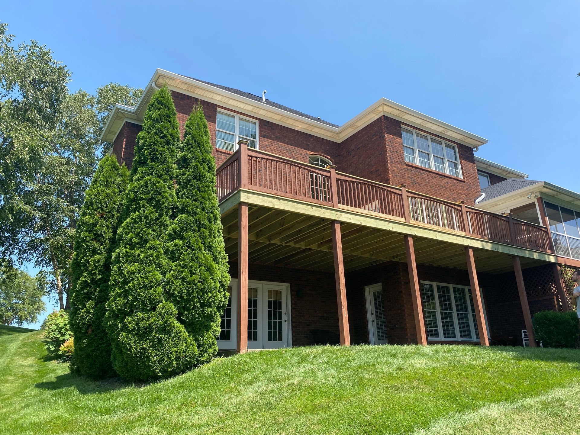 Pressure-treated pine deck with cedar handrail and lattice skirting