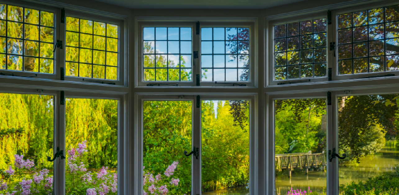 Bay window view framed by classic wood windows