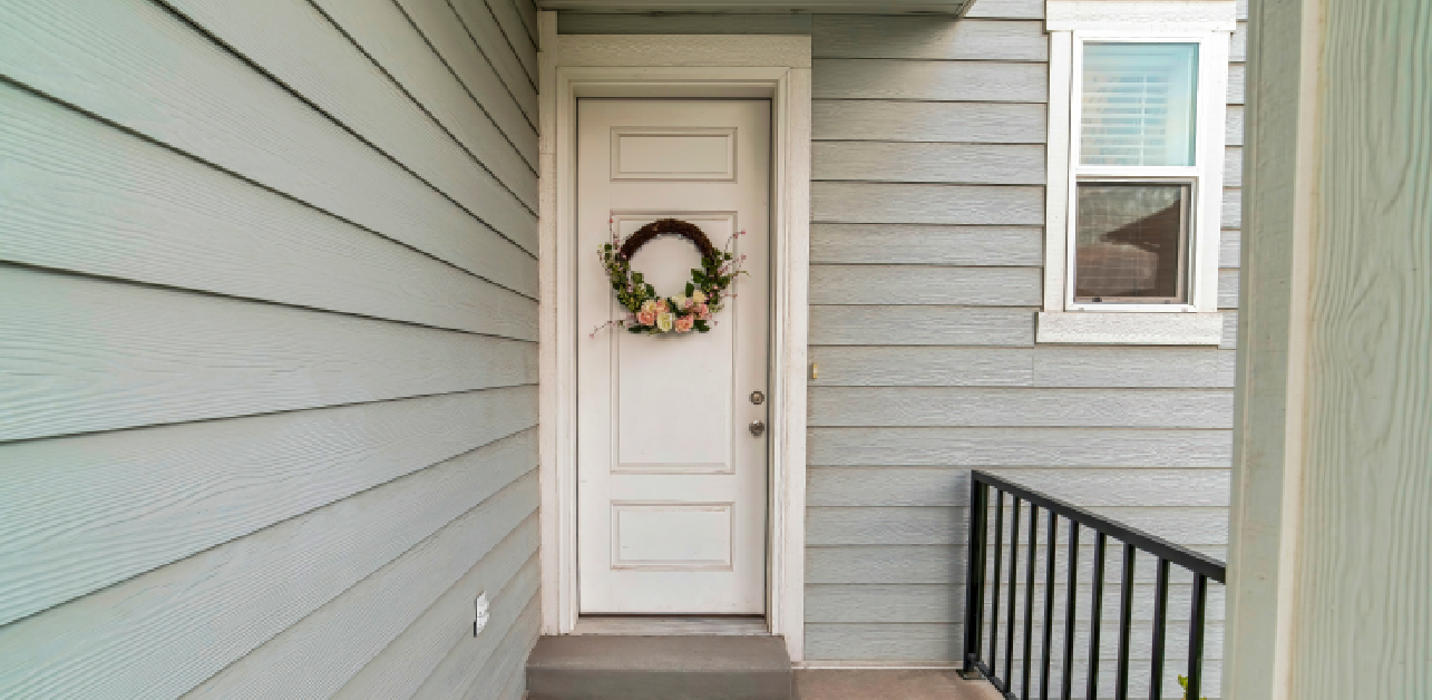 Residential entry door with floral wreath in Colorado