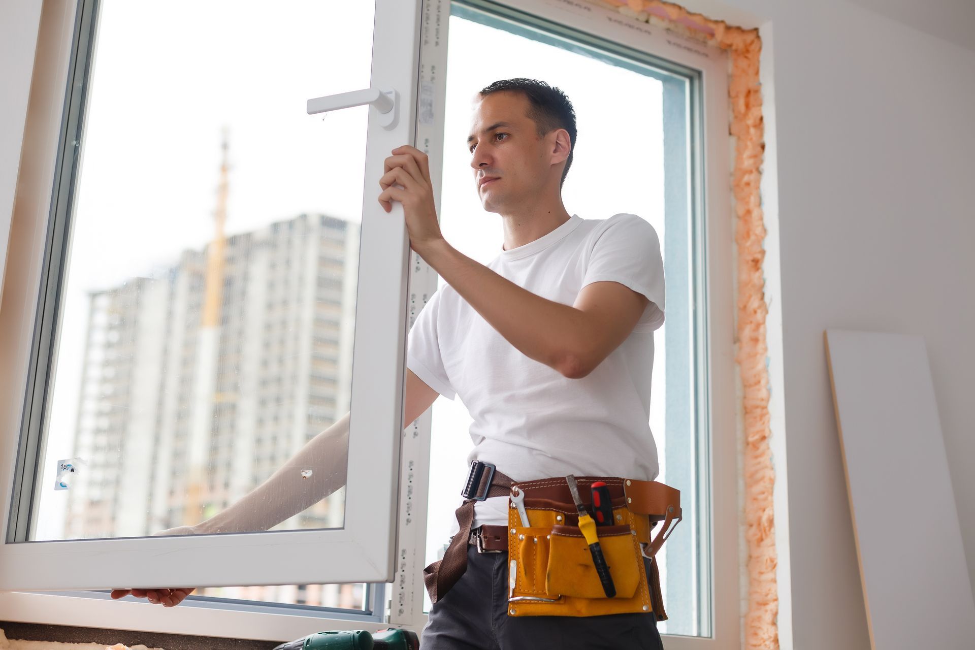 Denver window contractor explaining energy-efficient window options to homeowner