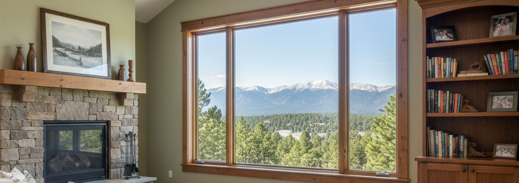 Spacious Colorado mountain home living room with large fiberglass picture window and mountain views