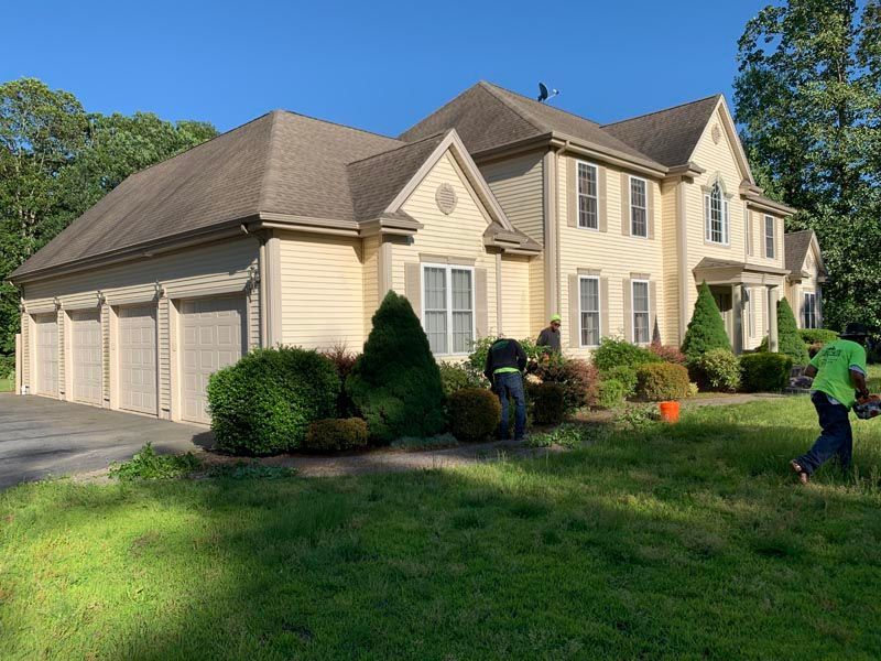 Residential lawn mowing service in progress
