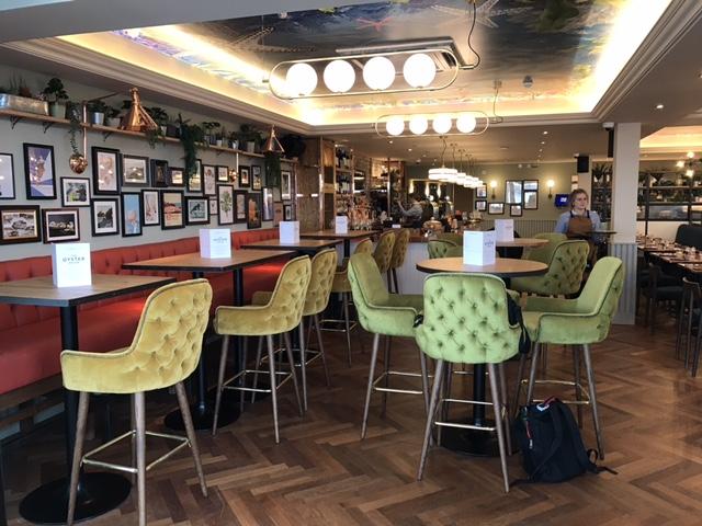 Oyster House, Mumbles, looking towards bar counter, showing coffered feature ceiling with decorative graphic.