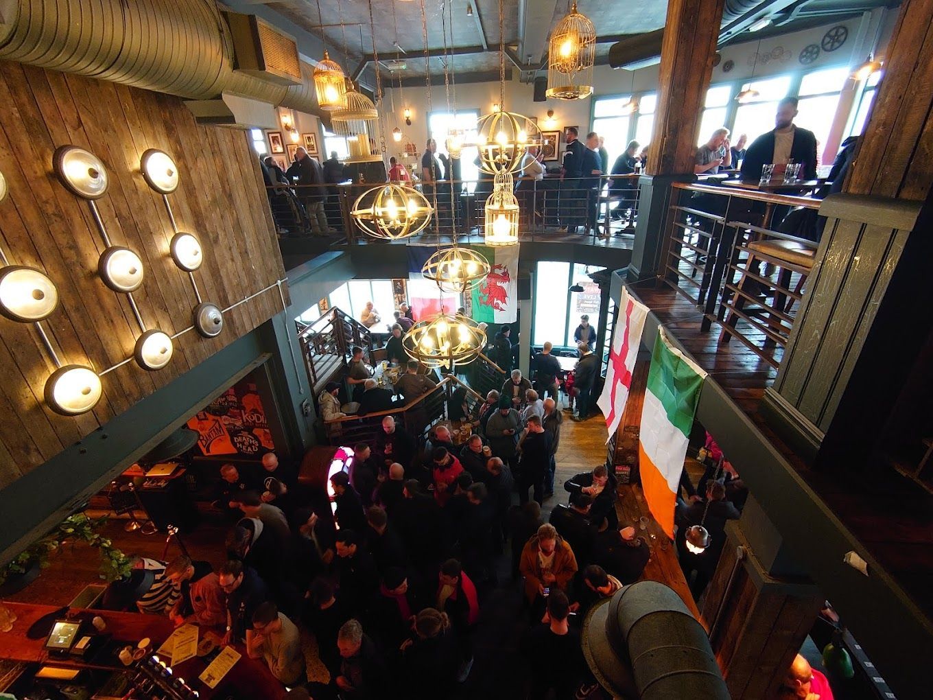 London Road Brew House, Southampton, looking across first floor atrium showing a packed pub.