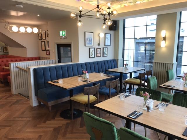 Oyster House, Mumbles, fixed seating area near windows, showing parquet flooring.