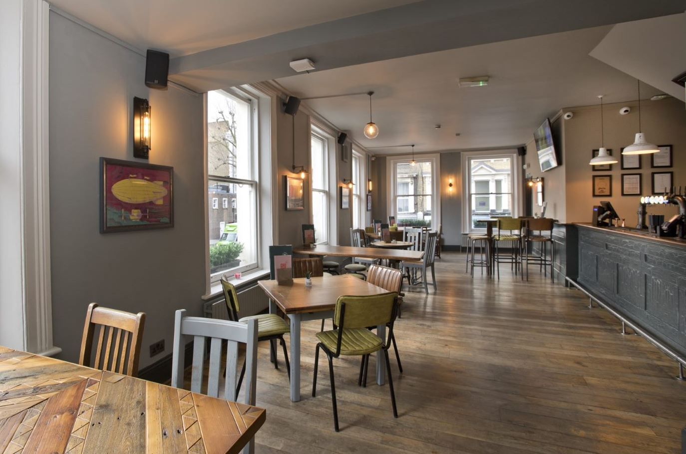 Prince of Teck, Earls Court, London, first floor dining/seating area with view of first floor bar counter.
