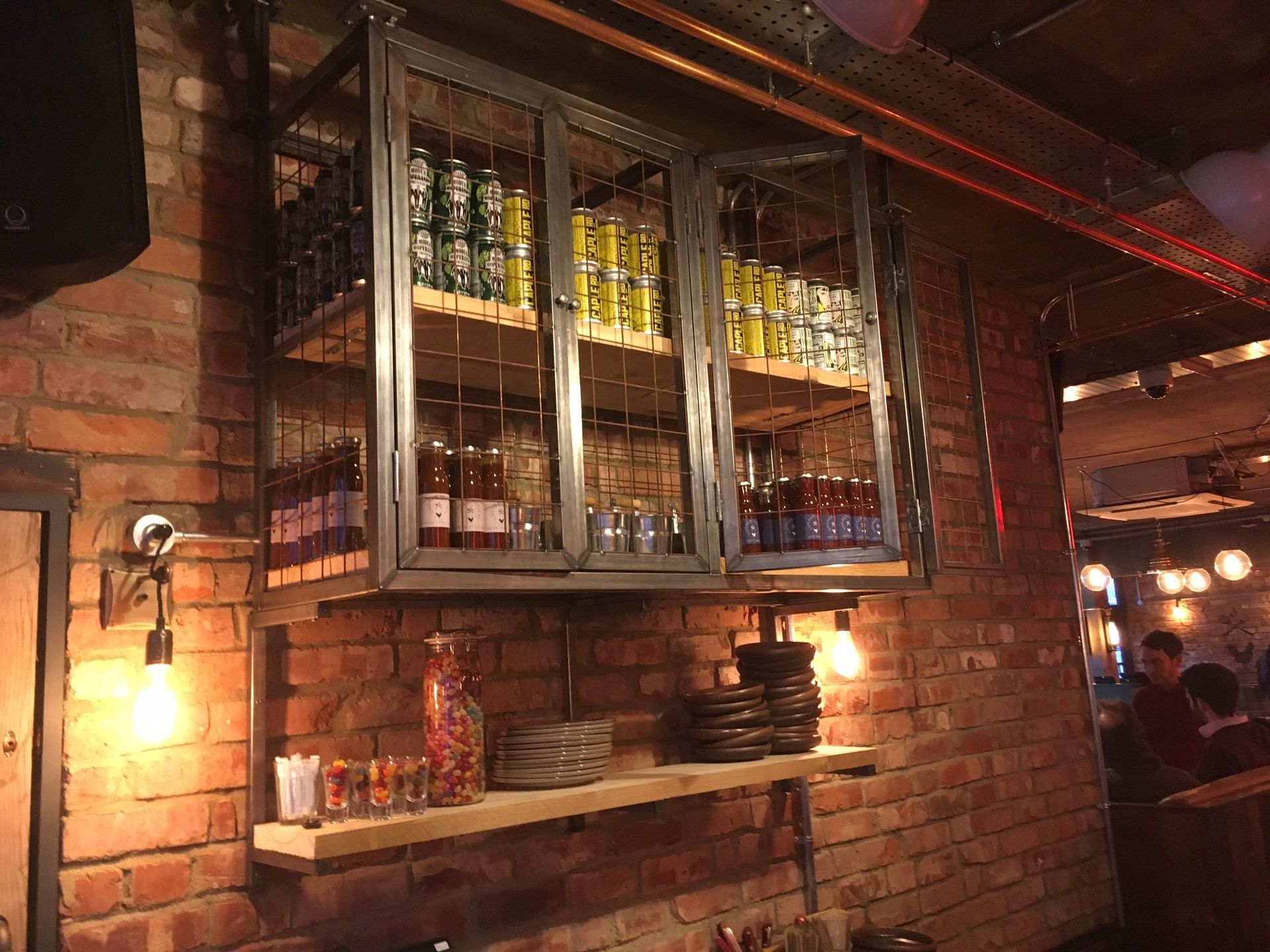 Chicken Society, Finchley, London, industrial design waiter station with mild steel caged wall gantry and scaffold board shelves.