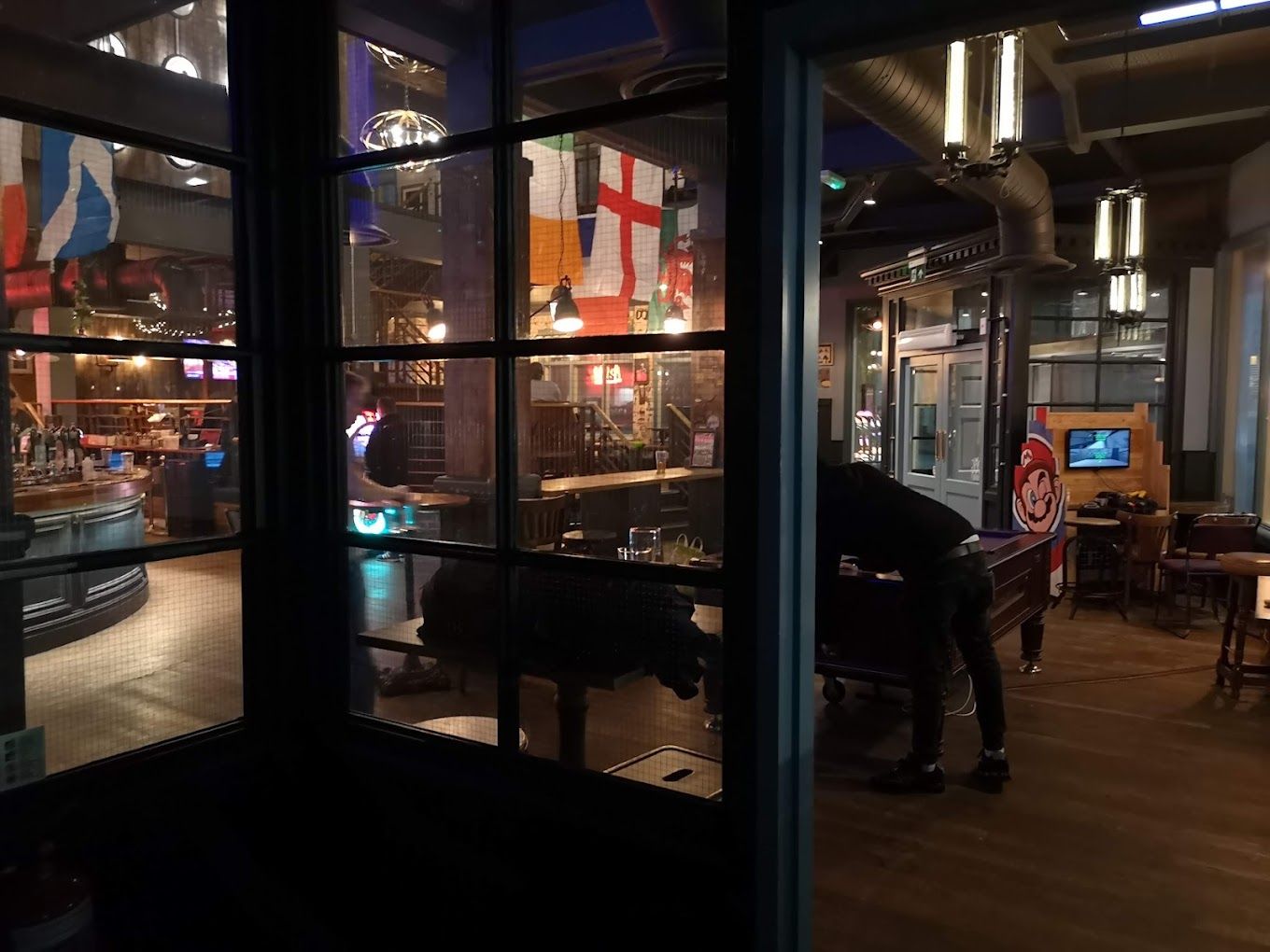 London Road Brew House, Southampton, view though glazing of ground floor games area.