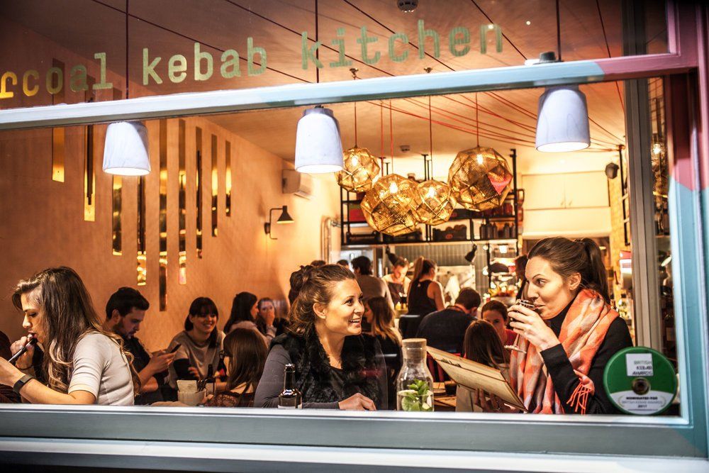 Ba Ba Boom, Clapham, London, showing customers sat in vertical window seating area.