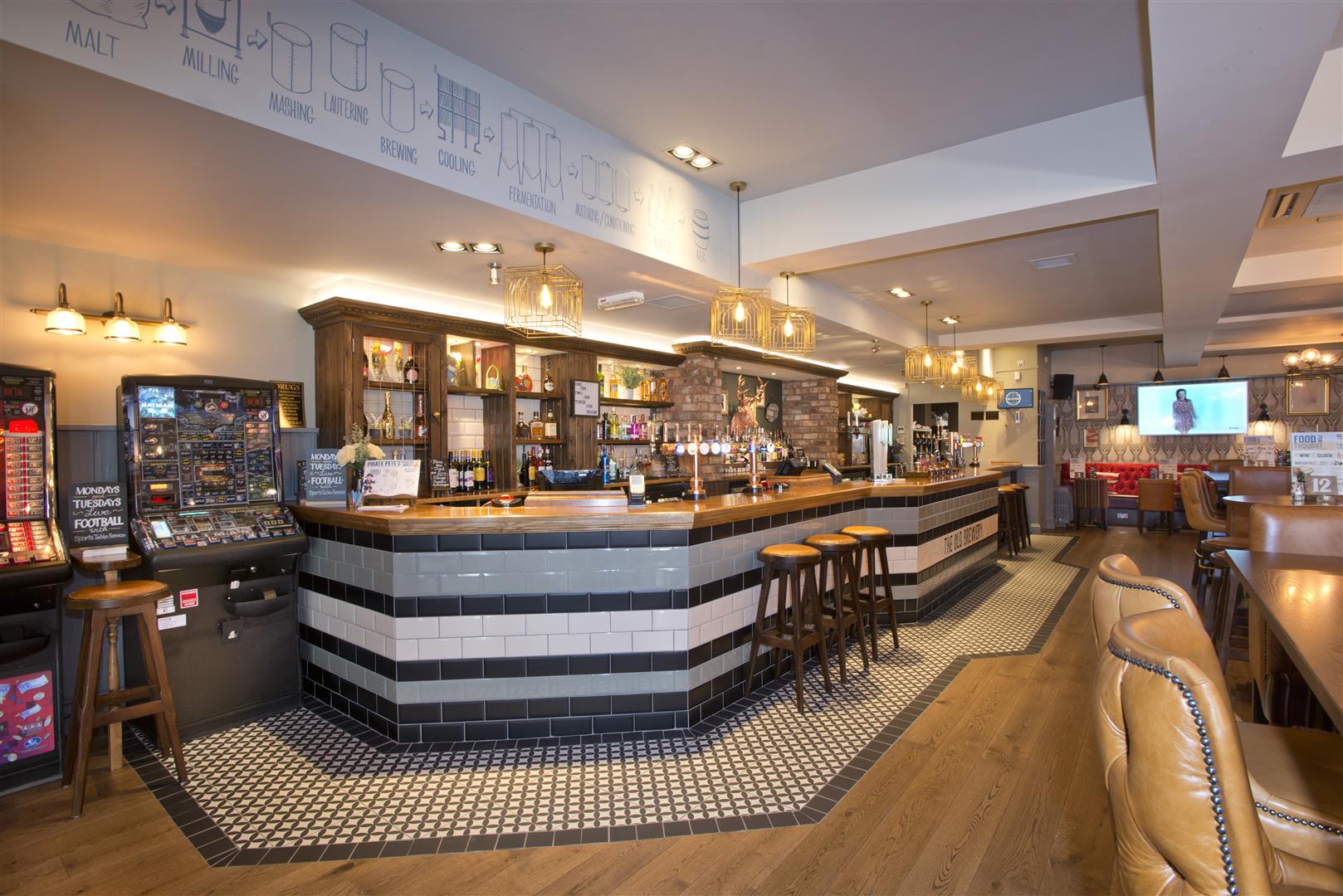 The Old Brewery, Marlow, looking towards ground floor main bar counter with tiled bar front and tiled bar walk.