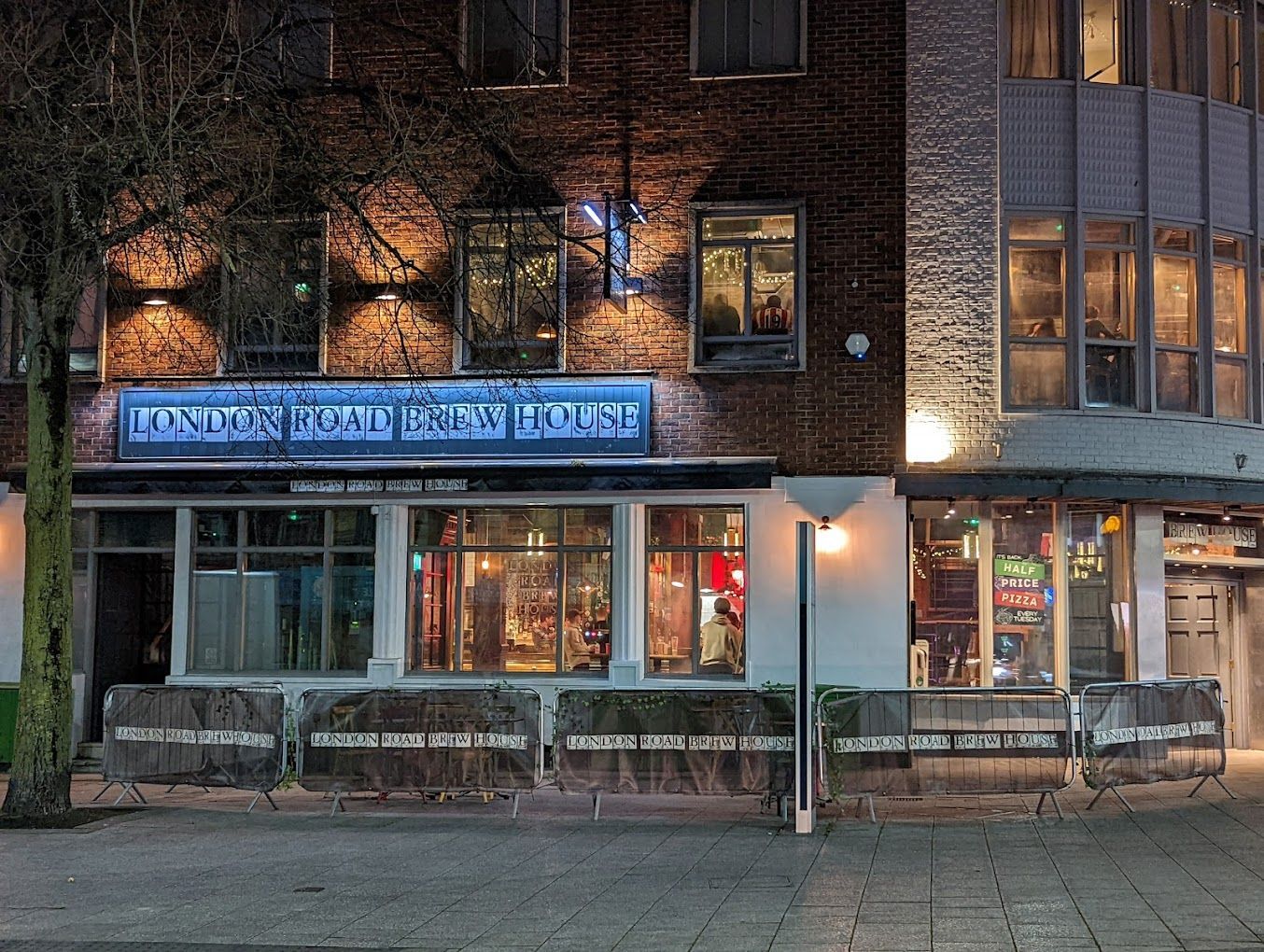 London Road Brew House, Southampton, external nightime view showing illuminated signage.