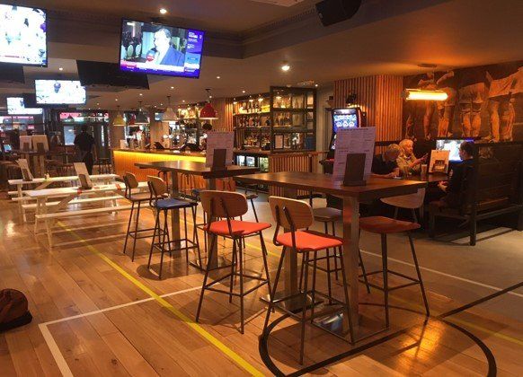 Sports Bar & Grill, Old Street, London, looking from central vertical drinking area over towards main bar counter