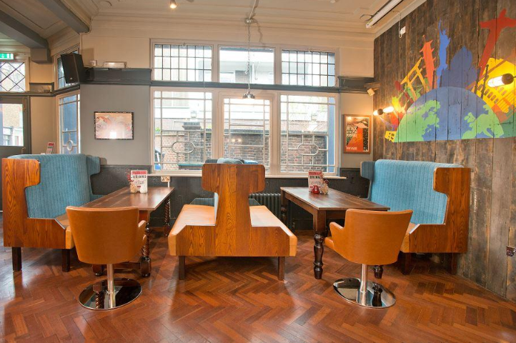 Whitecross Tap, Old Street, London, rear seating area with retro train carriage type seating.