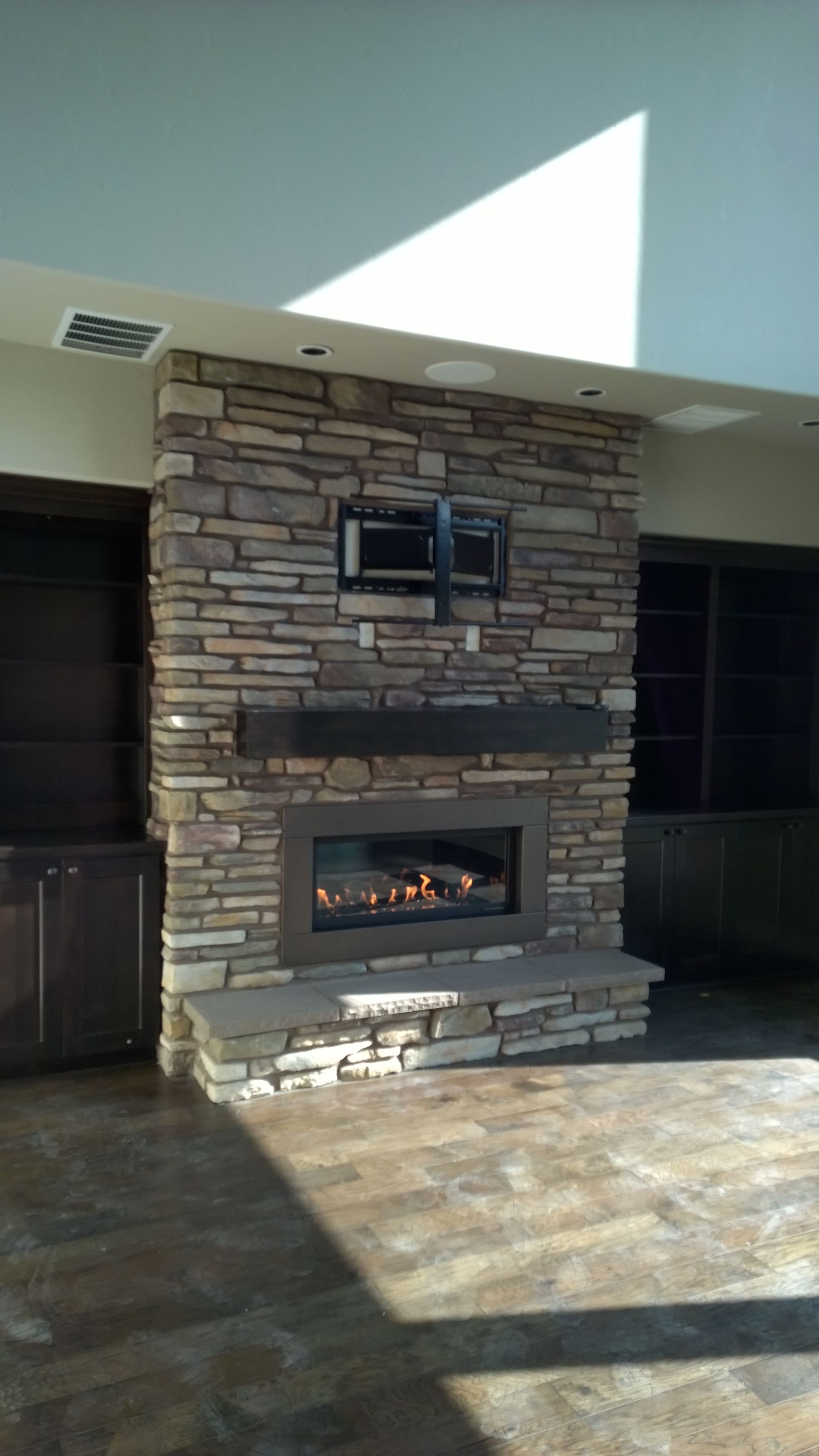 There is a fireplace in the middle of the room.