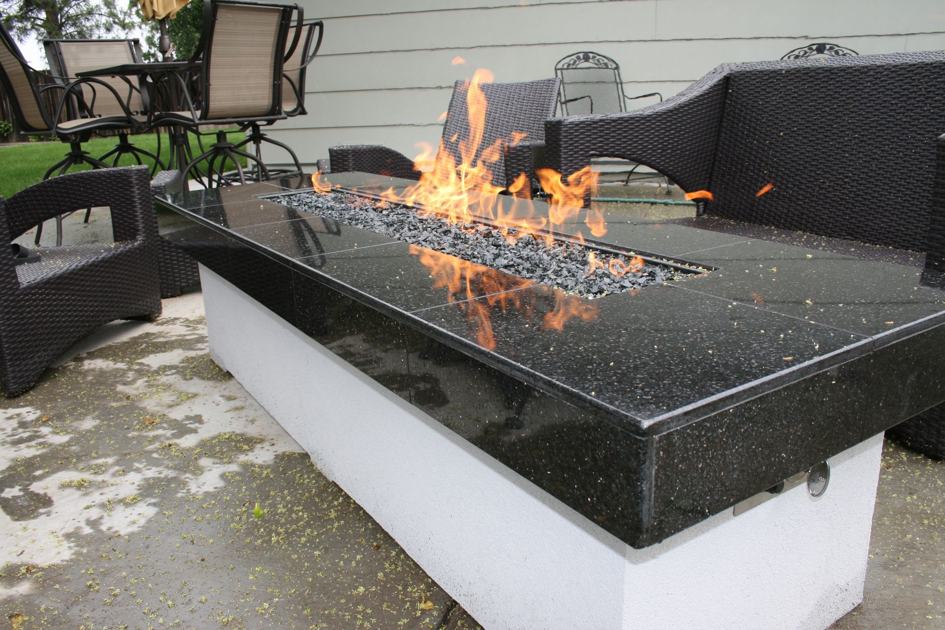 A fire pit with flames coming out of it