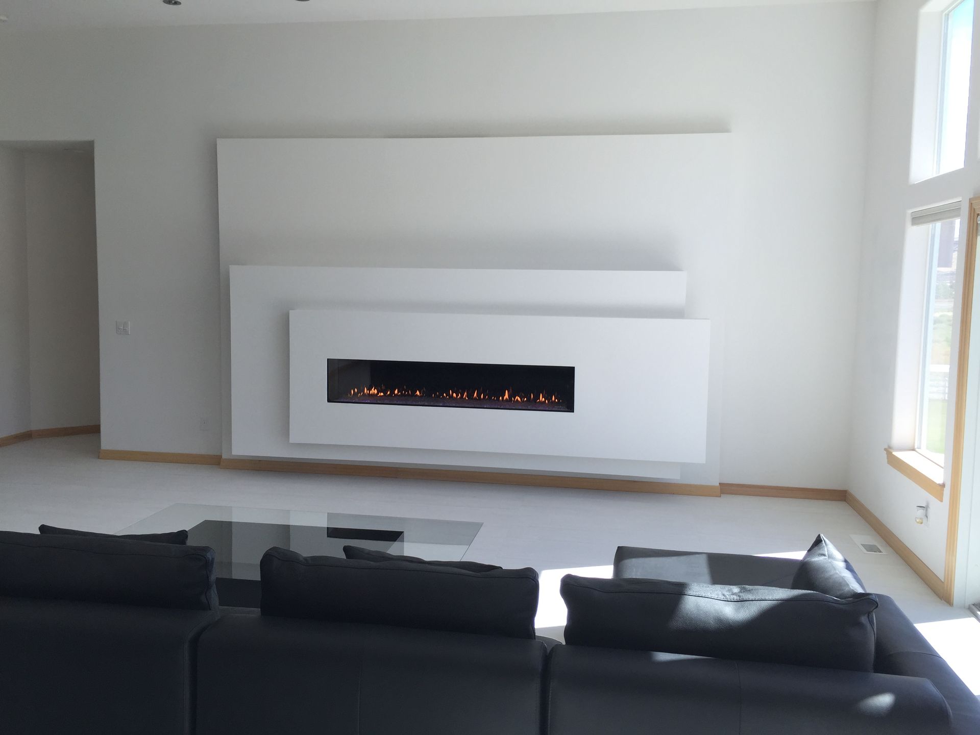 A living room with a fireplace and a couch