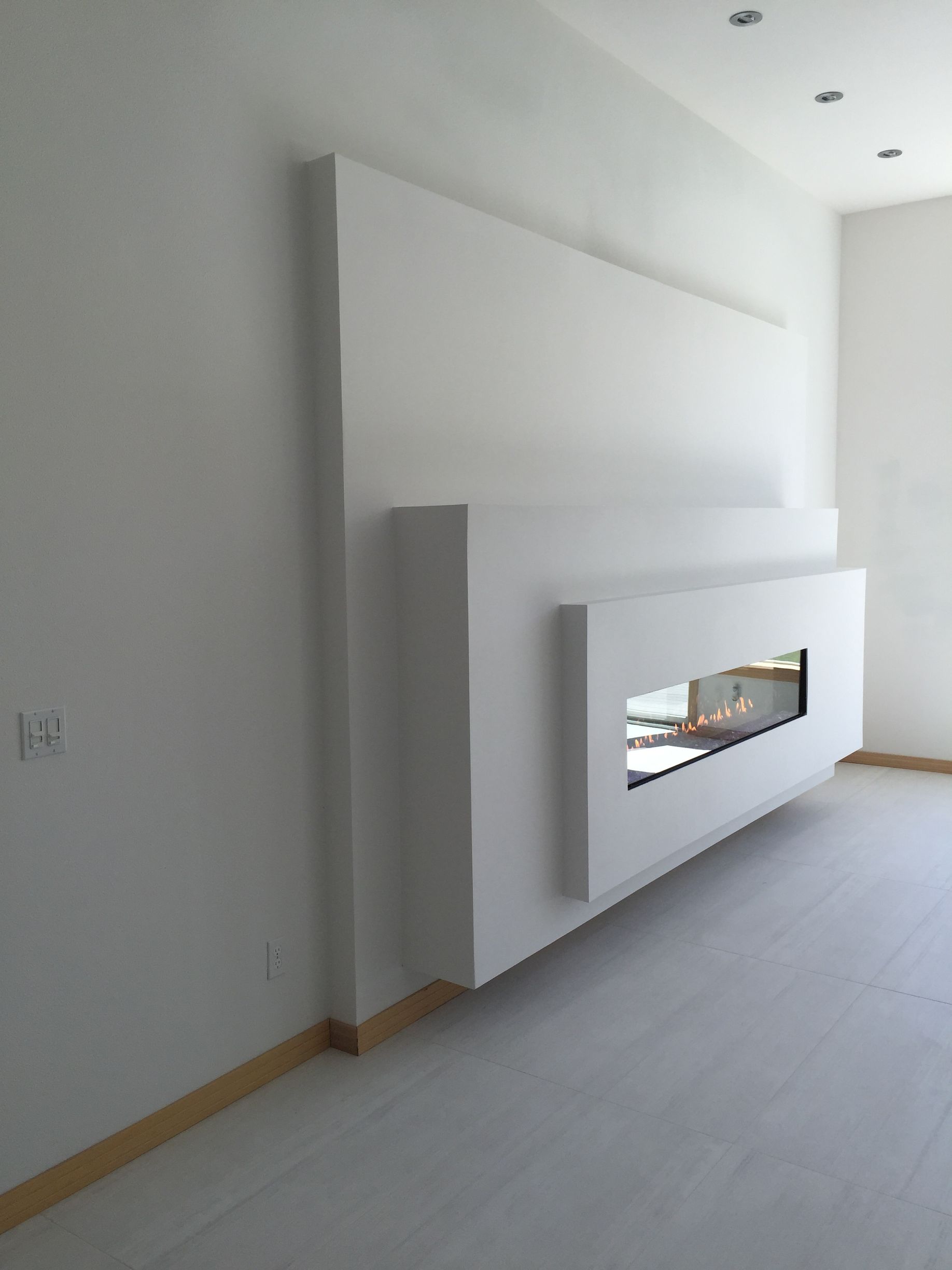 A fireplace is built into the wall in a living room.