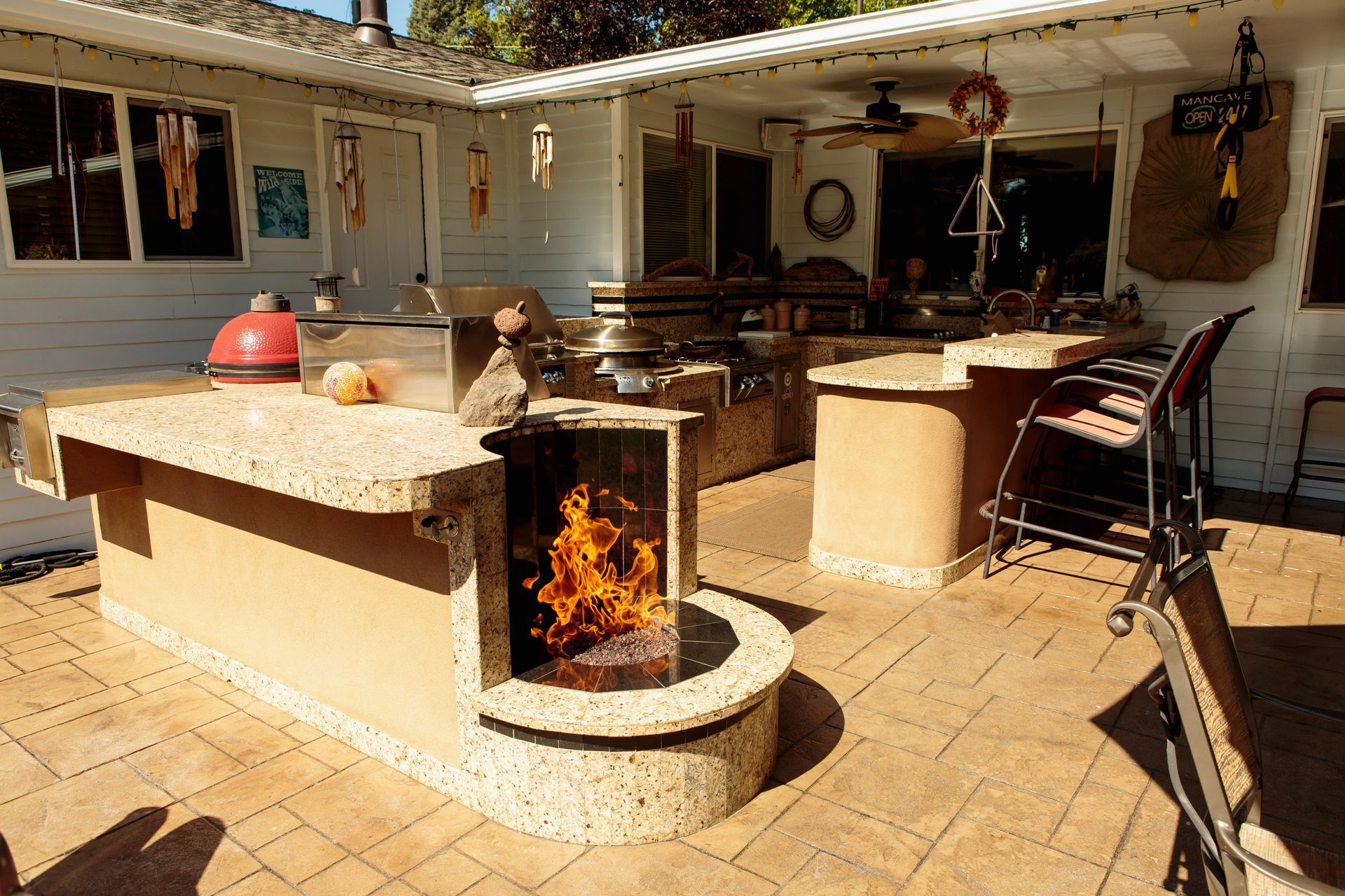 There is a fire pit in the middle of the patio.