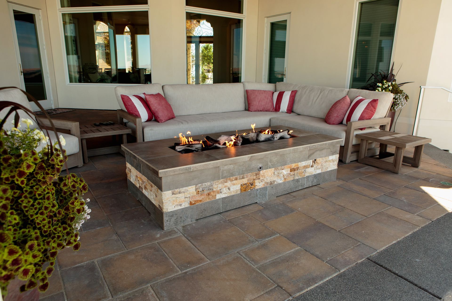 There is a fire pit in the middle of the patio.