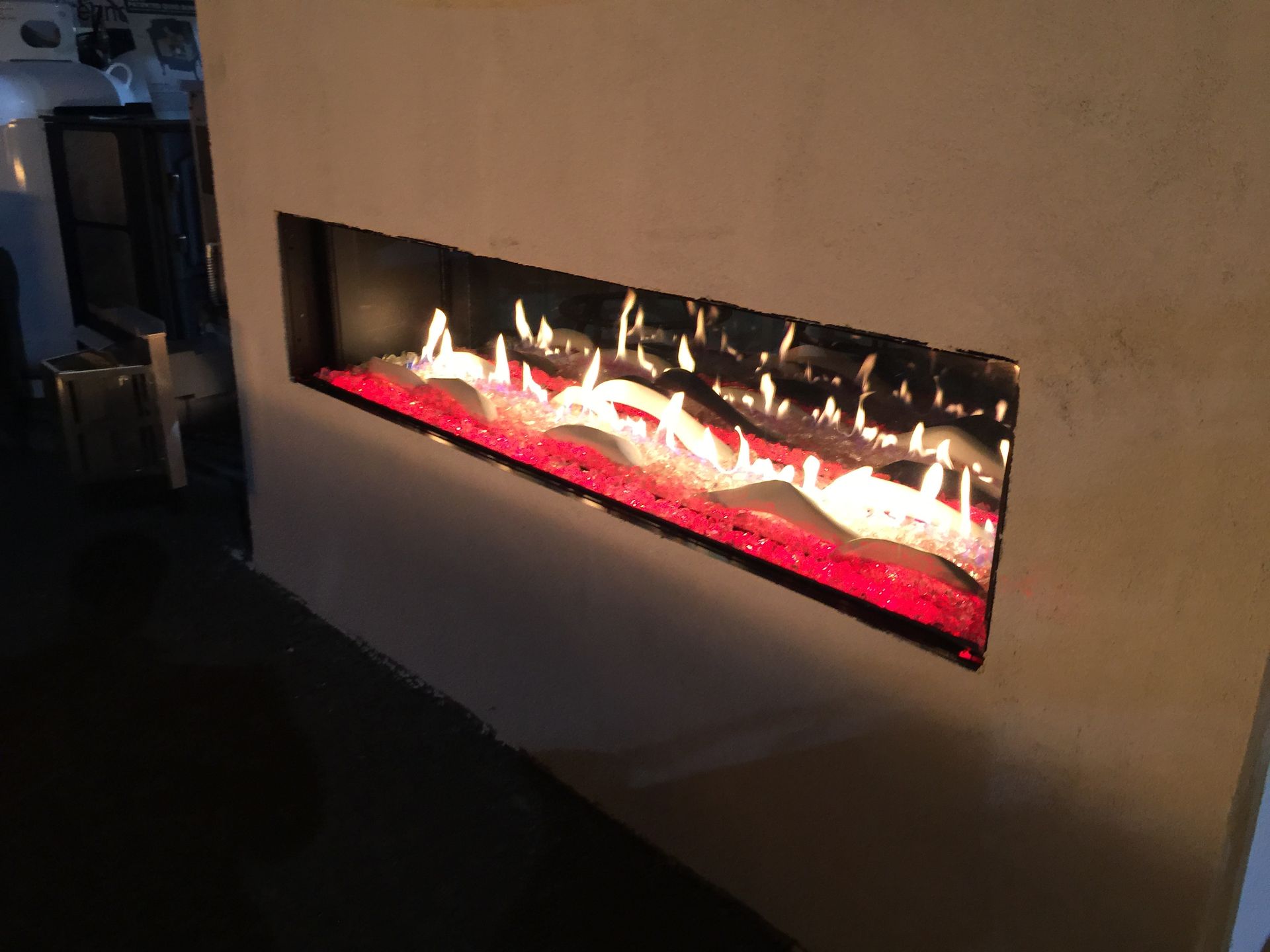 A fireplace with red flames coming out of it