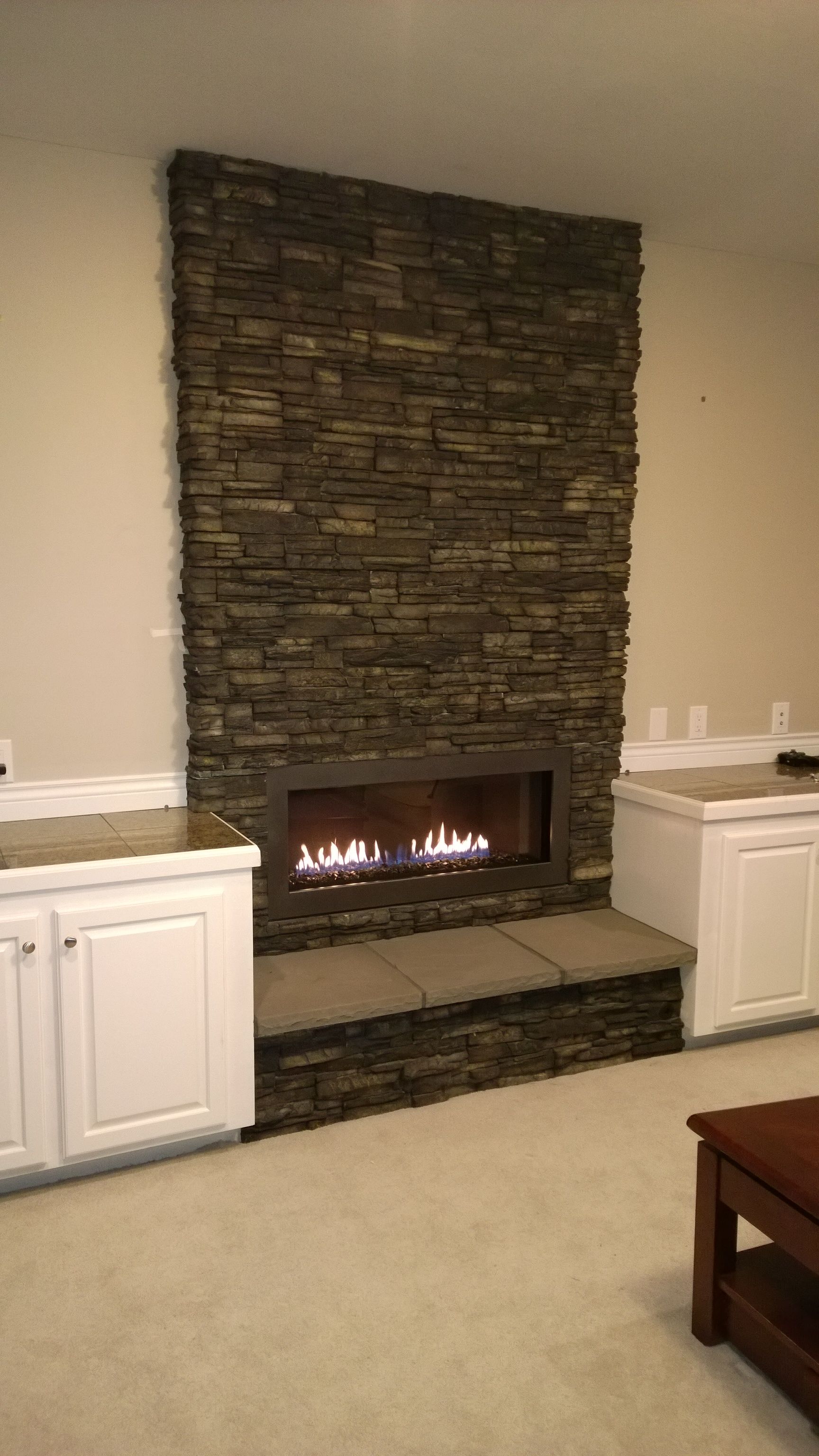 There is a fireplace in the middle of the room.
