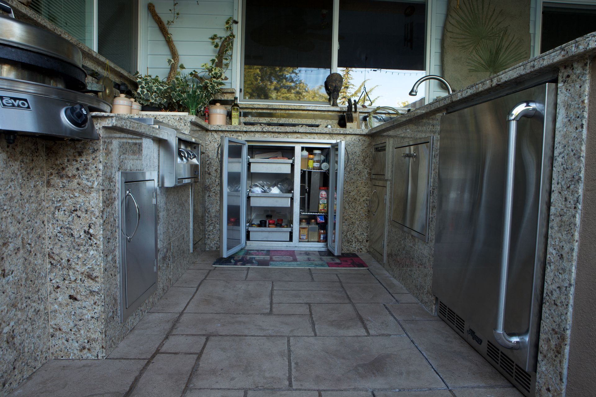 A kitchen with stainless steel appliances and granite counter tops