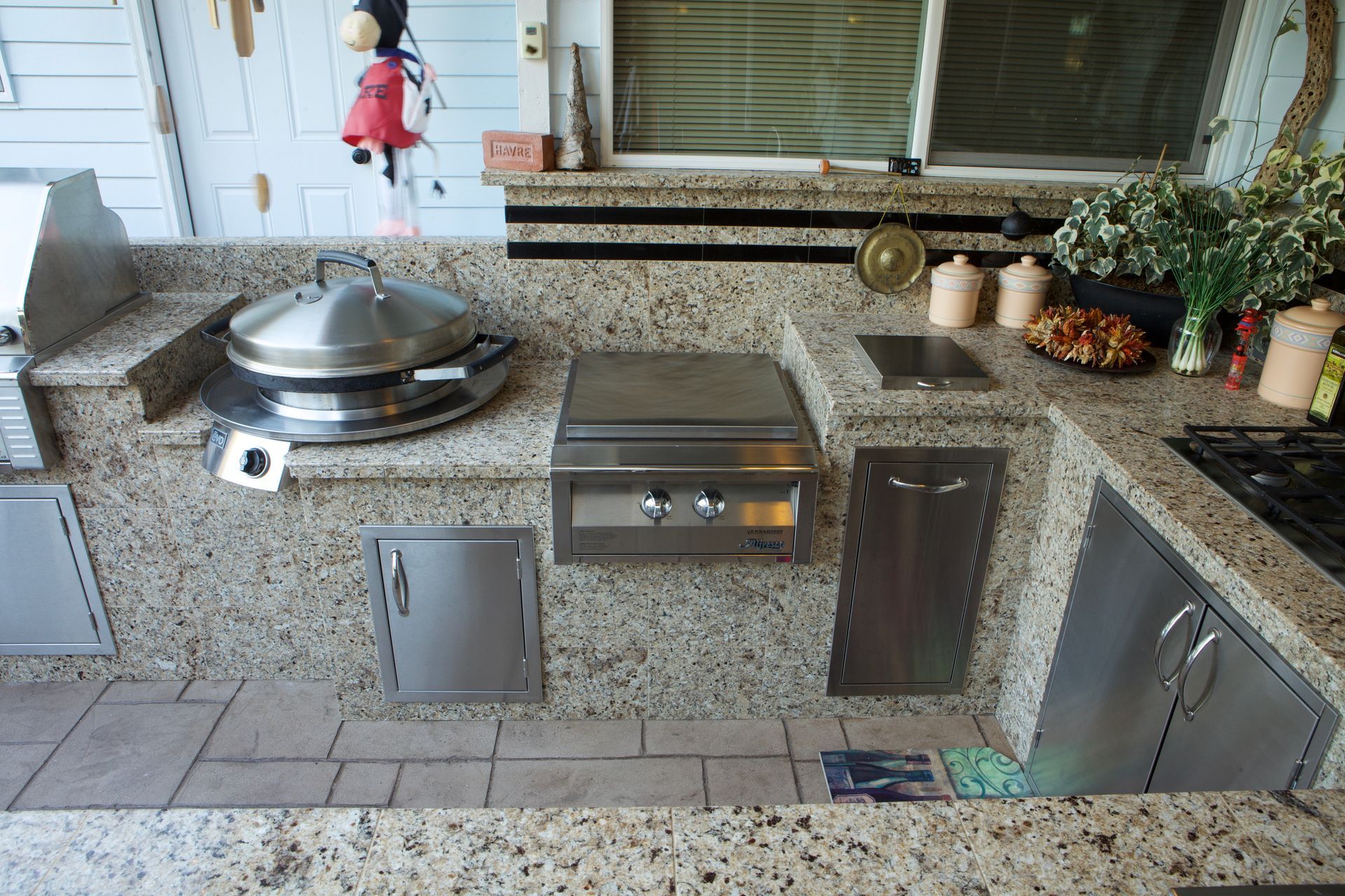 A kitchen with granite counter tops and stainless steel appliances