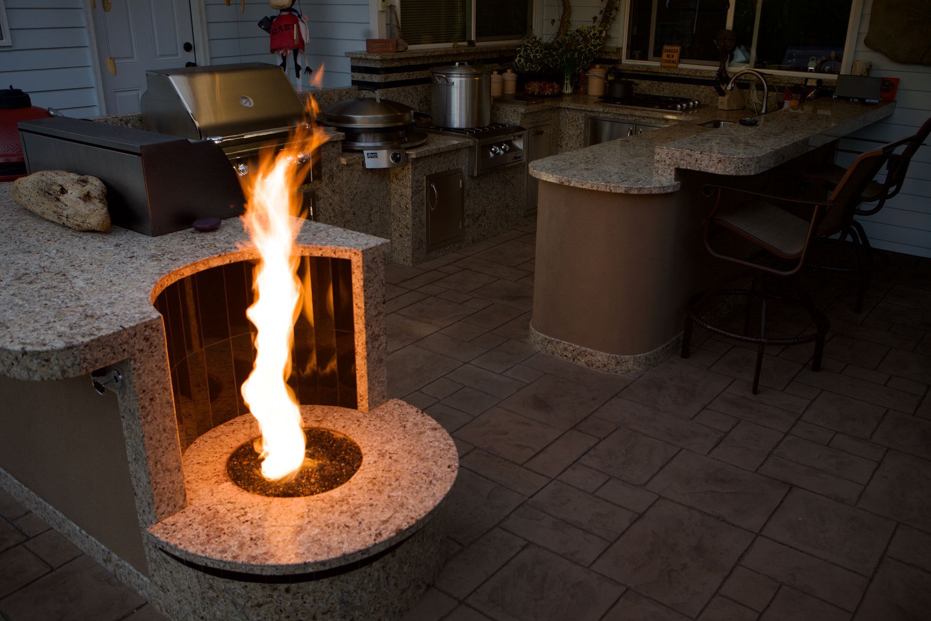 A fireplace with a flame coming out of it