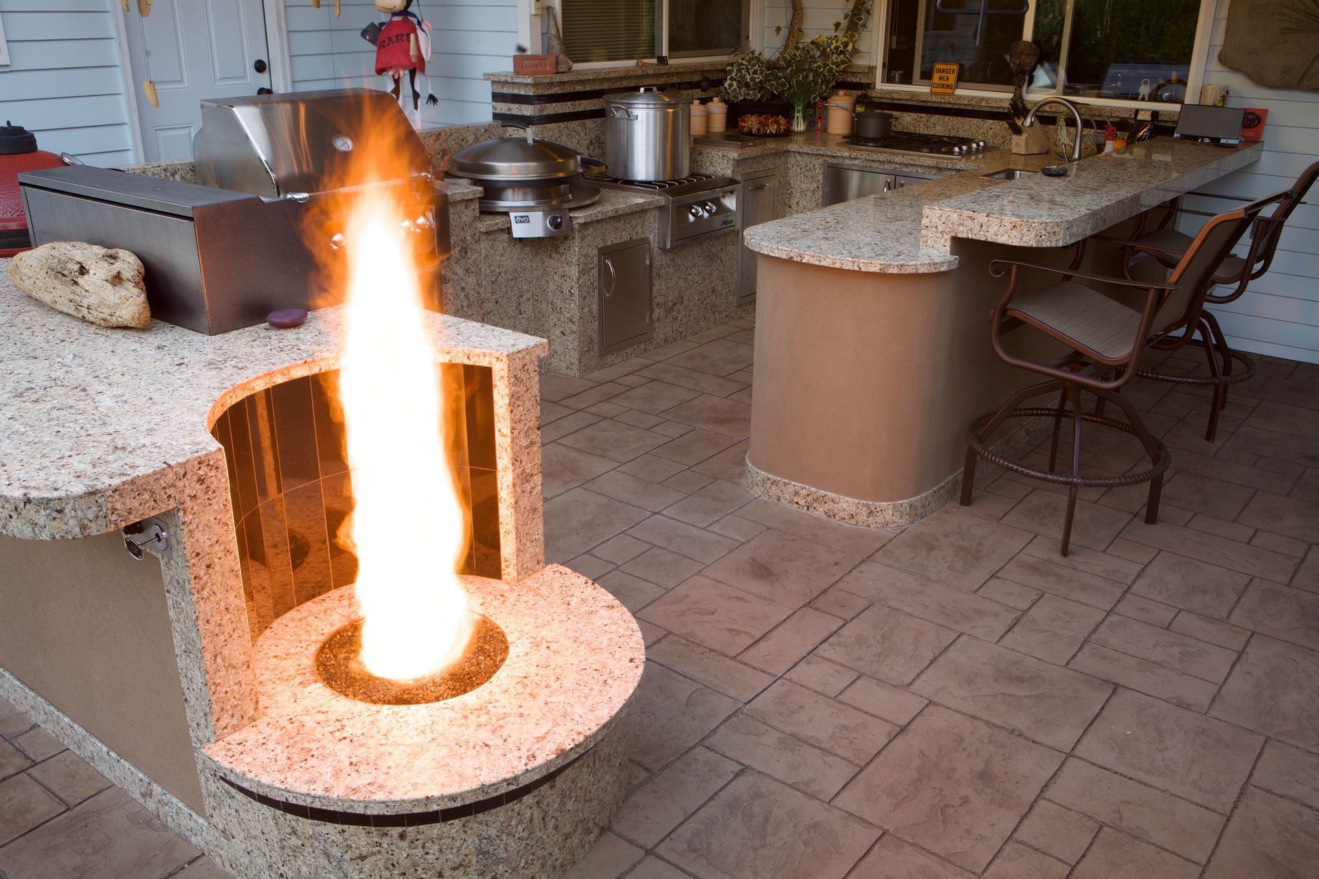 A kitchen with a fire coming out of it