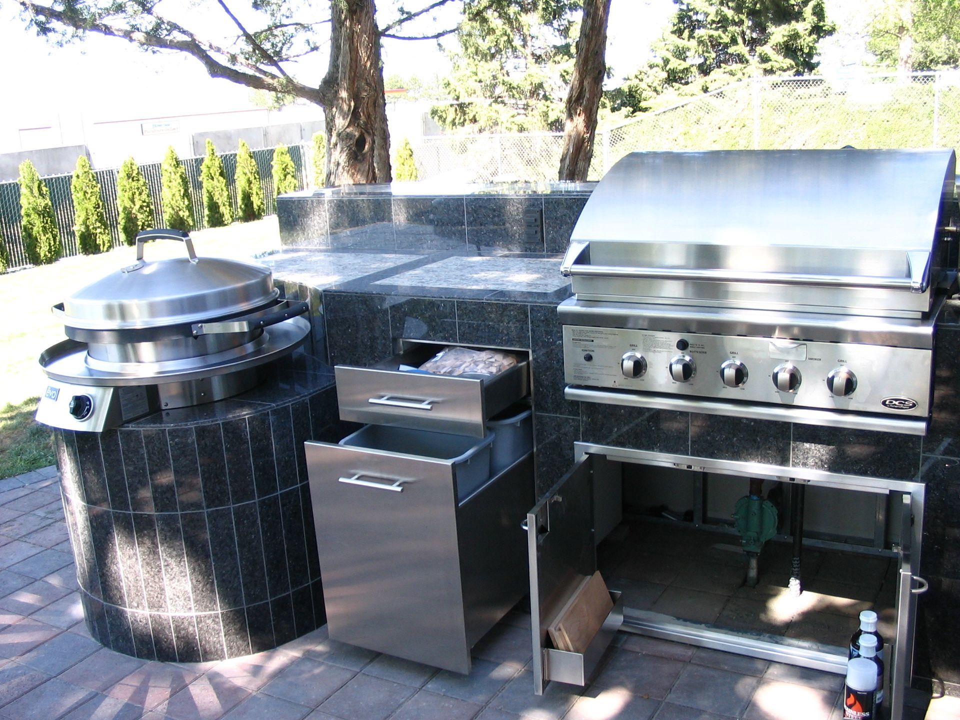 A stainless steel grill with the door open