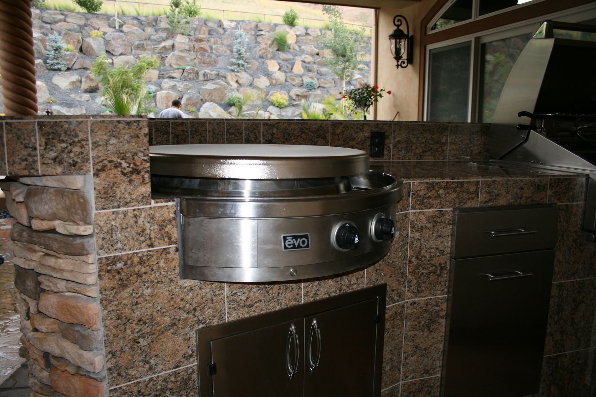 A stainless steel grill with the word evo on it