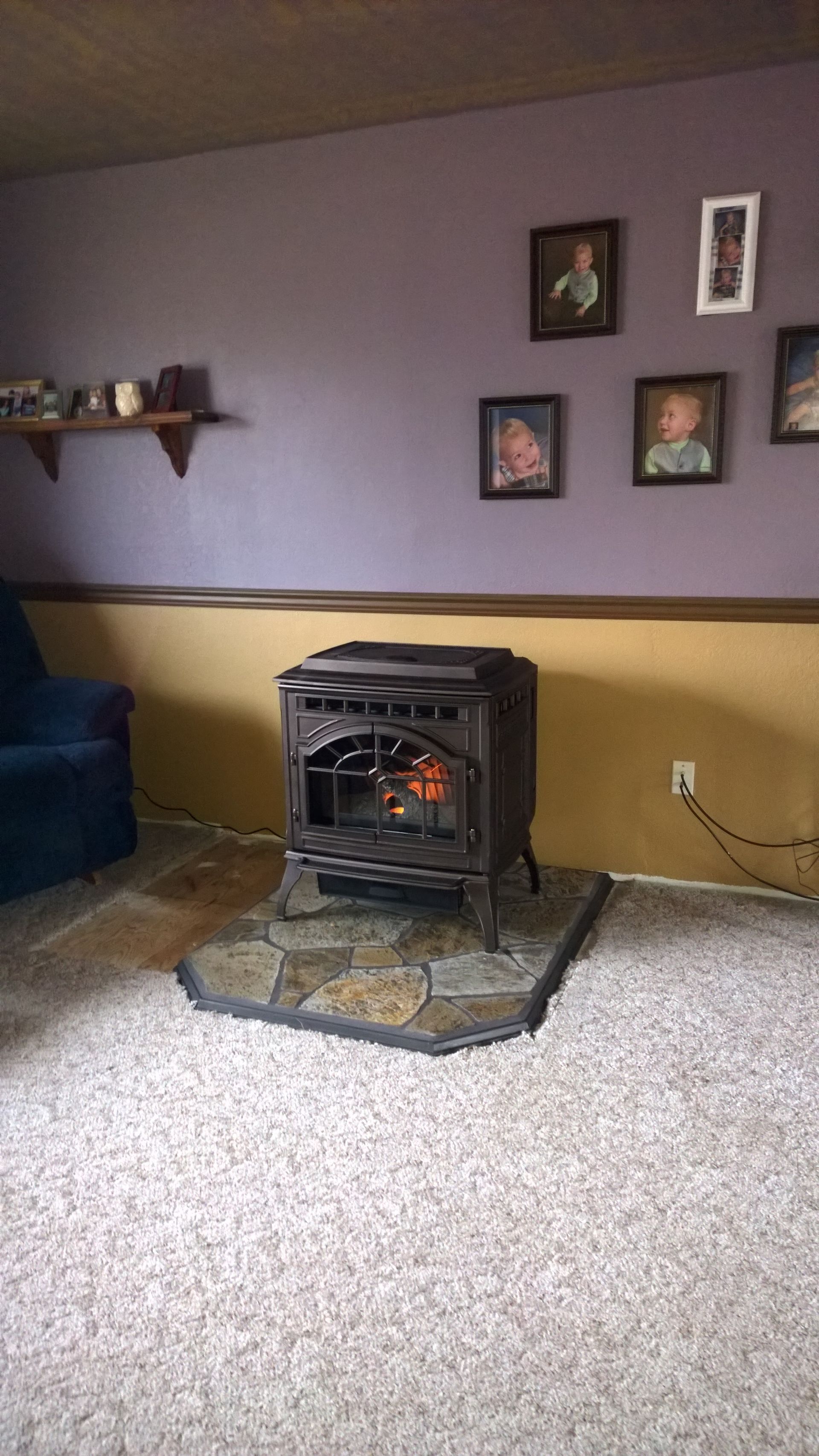 There is a wood stove in the middle of the room.