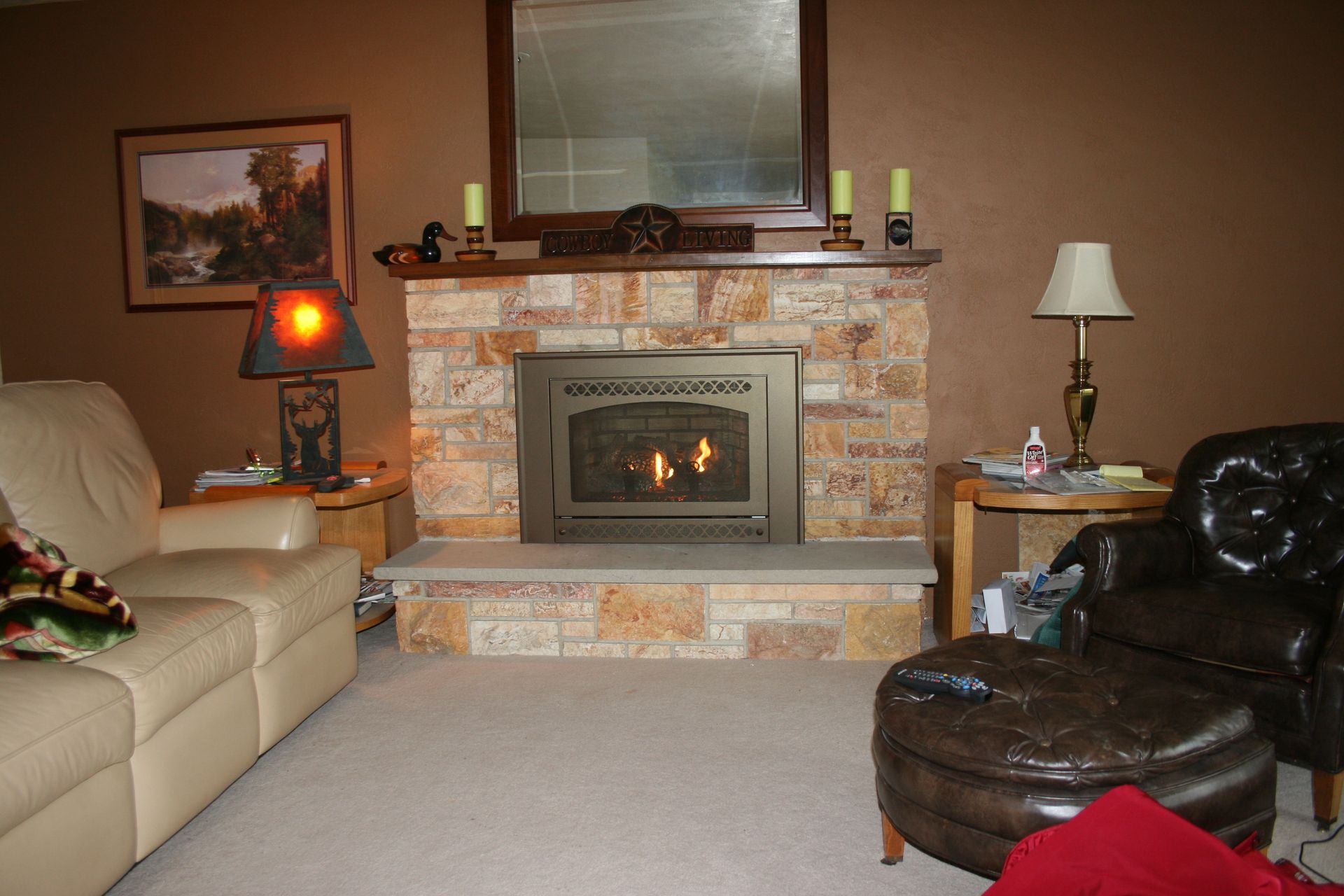 A living room with a fireplace and a couch