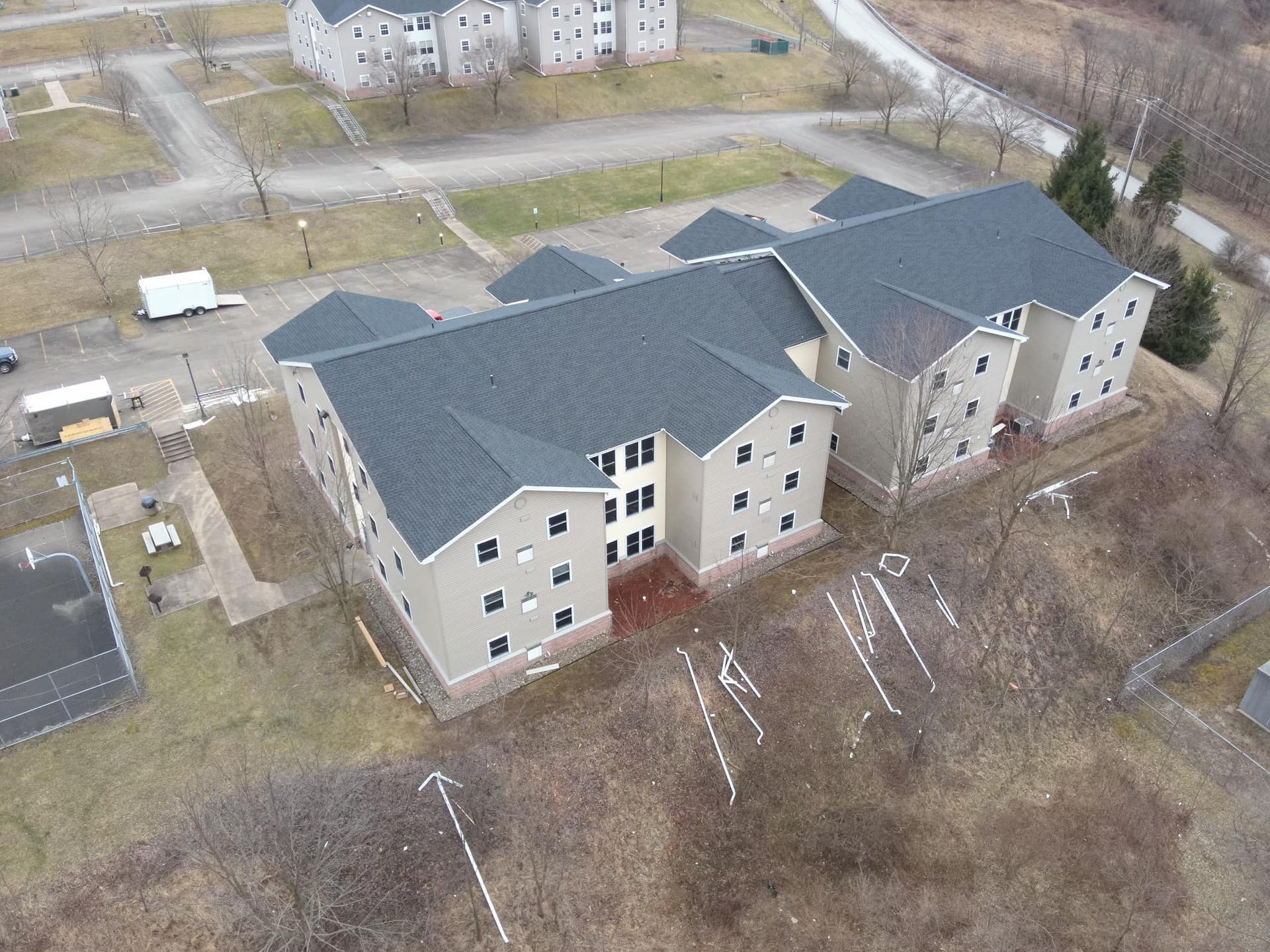 An aerial view of a building under construction in the snow