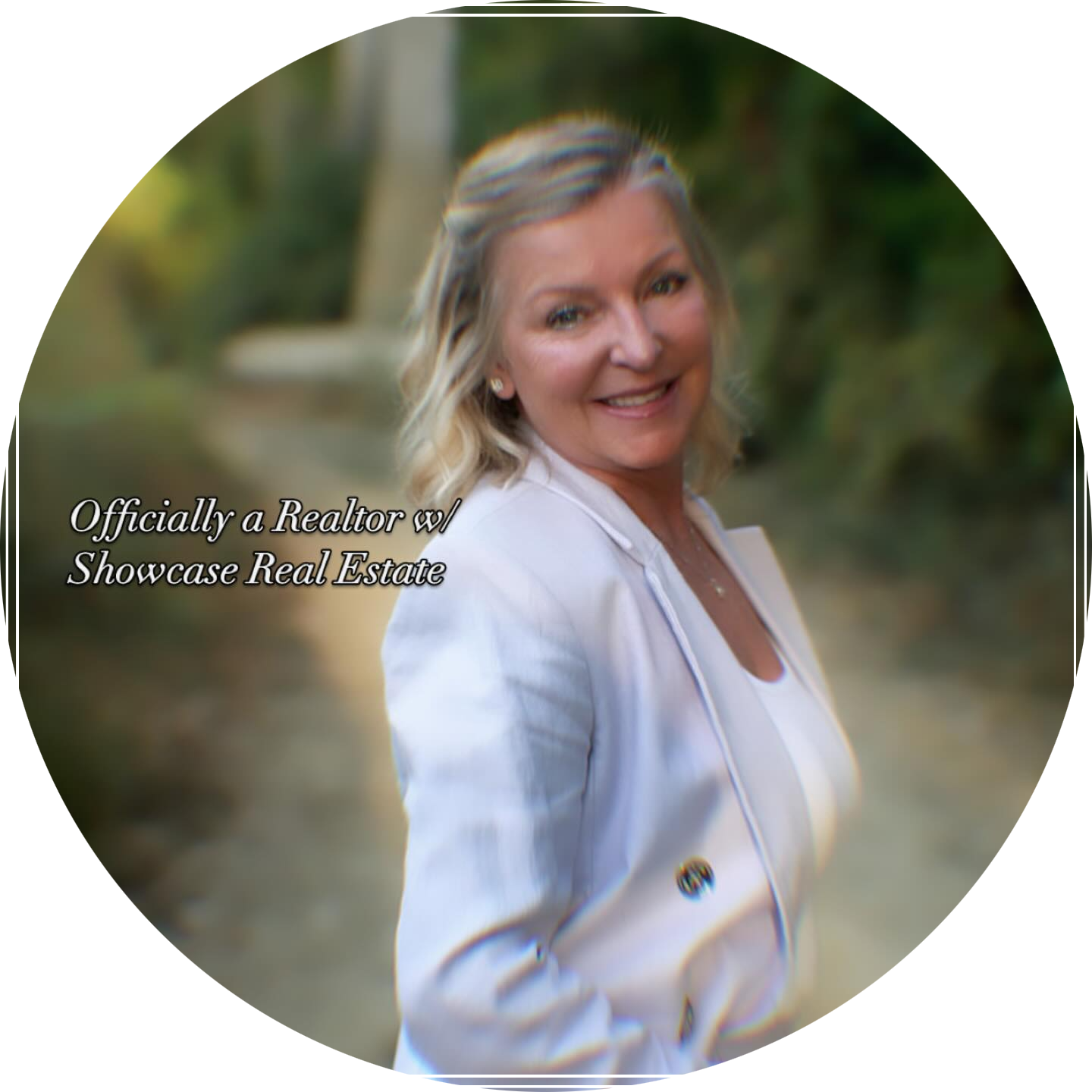 A woman in a white jacket stands in a circle with the words officially a realtor at showcase real estate