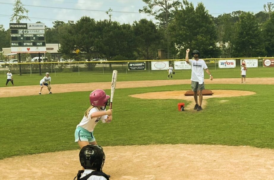 Kids at 6 rings camp playing baseball