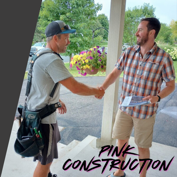 A man is shaking hands with another man on a porch.